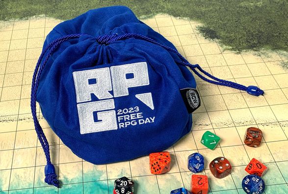 Blue dice bag with the Free RPG Day logo patch. From BCW.