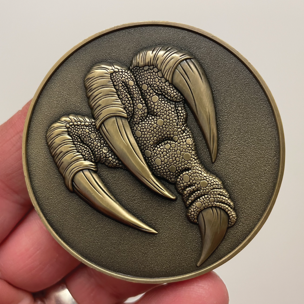Back of Griffon Goliath Coin in hand.png
