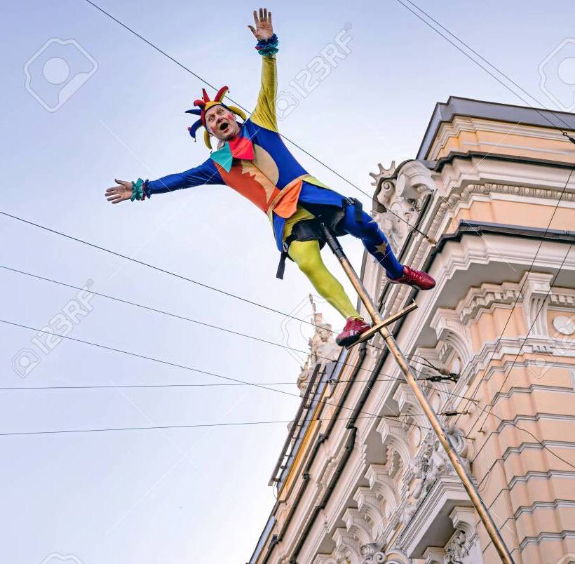 circus-clown-acrobat-swinging-on-a-long-pole.jpg