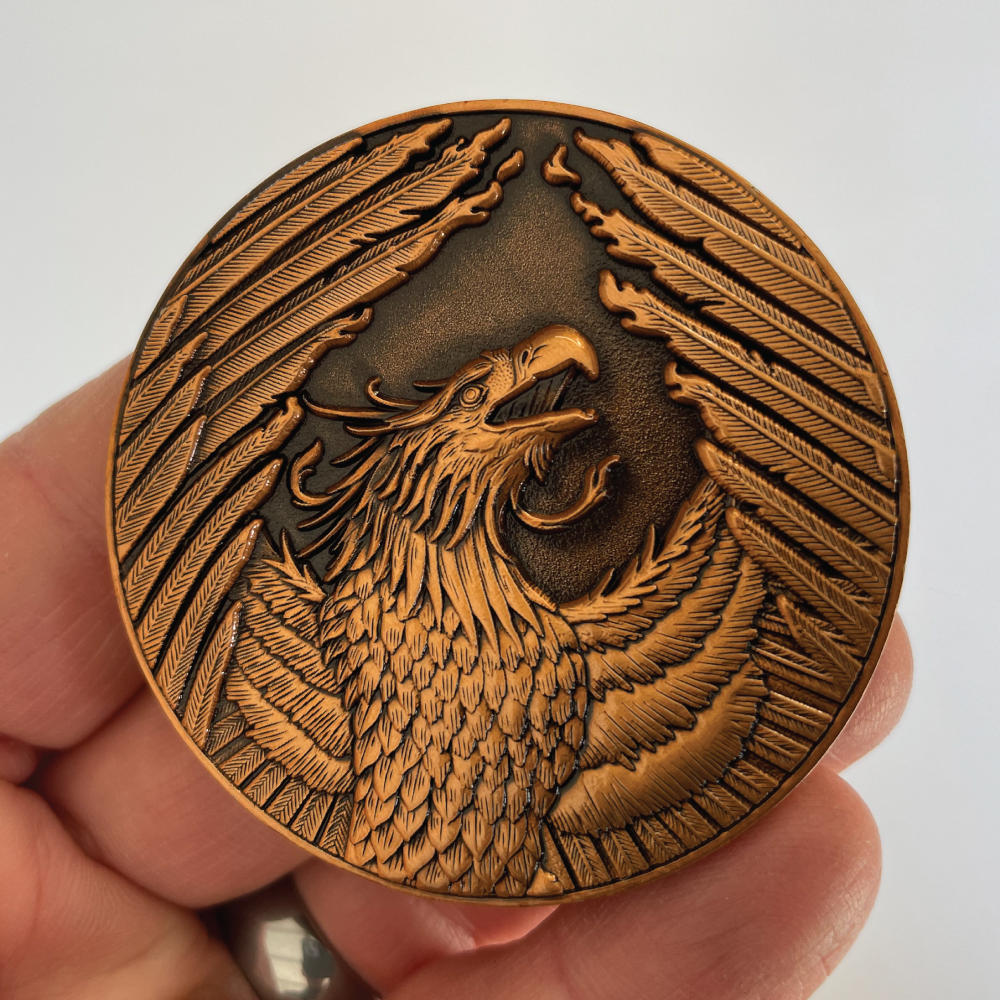 Front-of-Phoenix-Goliath-Coin-in-hand.png
