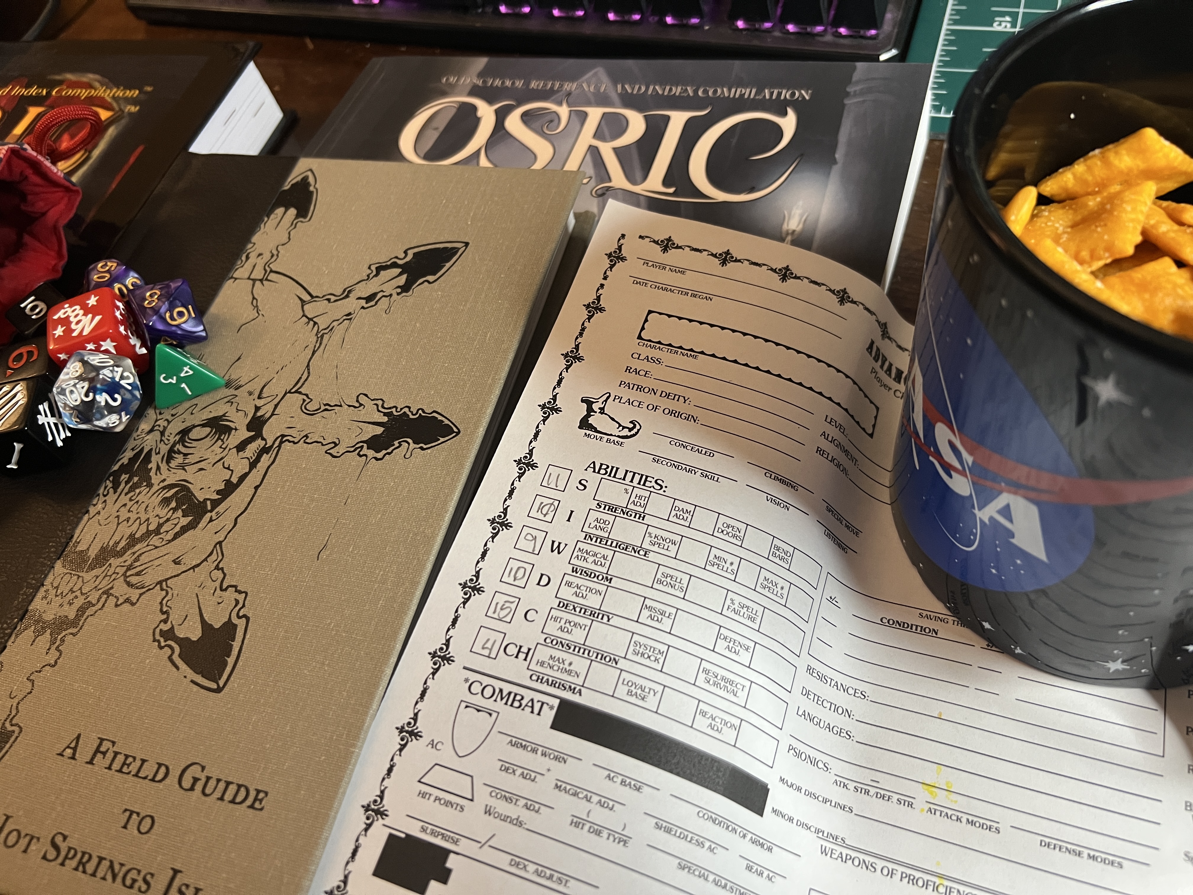 OSRIC, cheezits, Hot Springs Island, Cheezits and a character sheet with a 4 Charisma. Making enmities out of sheer stubbornness!