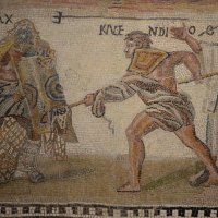 Mosaic_showing_a_retiarius_(net-fighter)_named_Kalendio_fighting_a_secutor_named_Astyanax,_3rd...jpg