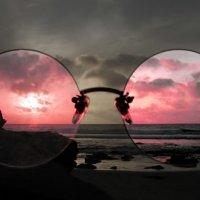 large-rose-colored-glasses-on-beach.jpg
