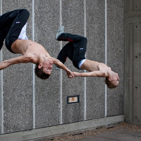 Jump wallrun aerial duo Parkour.png
