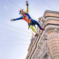 circus-clown-acrobat-swinging-on-a-long-pole.jpg