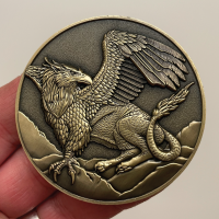 Front of Griffon Goliath Coin in hand.png