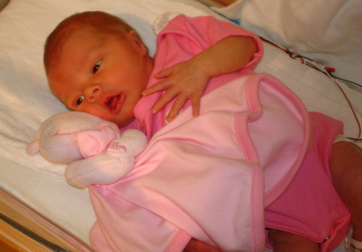 007 - Mia laying down with Luvvy, her hippo blanket friend.jpg