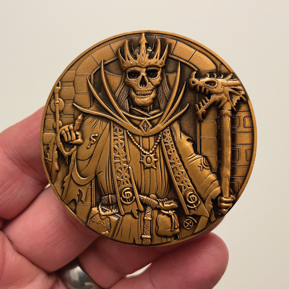 Front-of-Lich-Goliath-Coin-in-hand.png